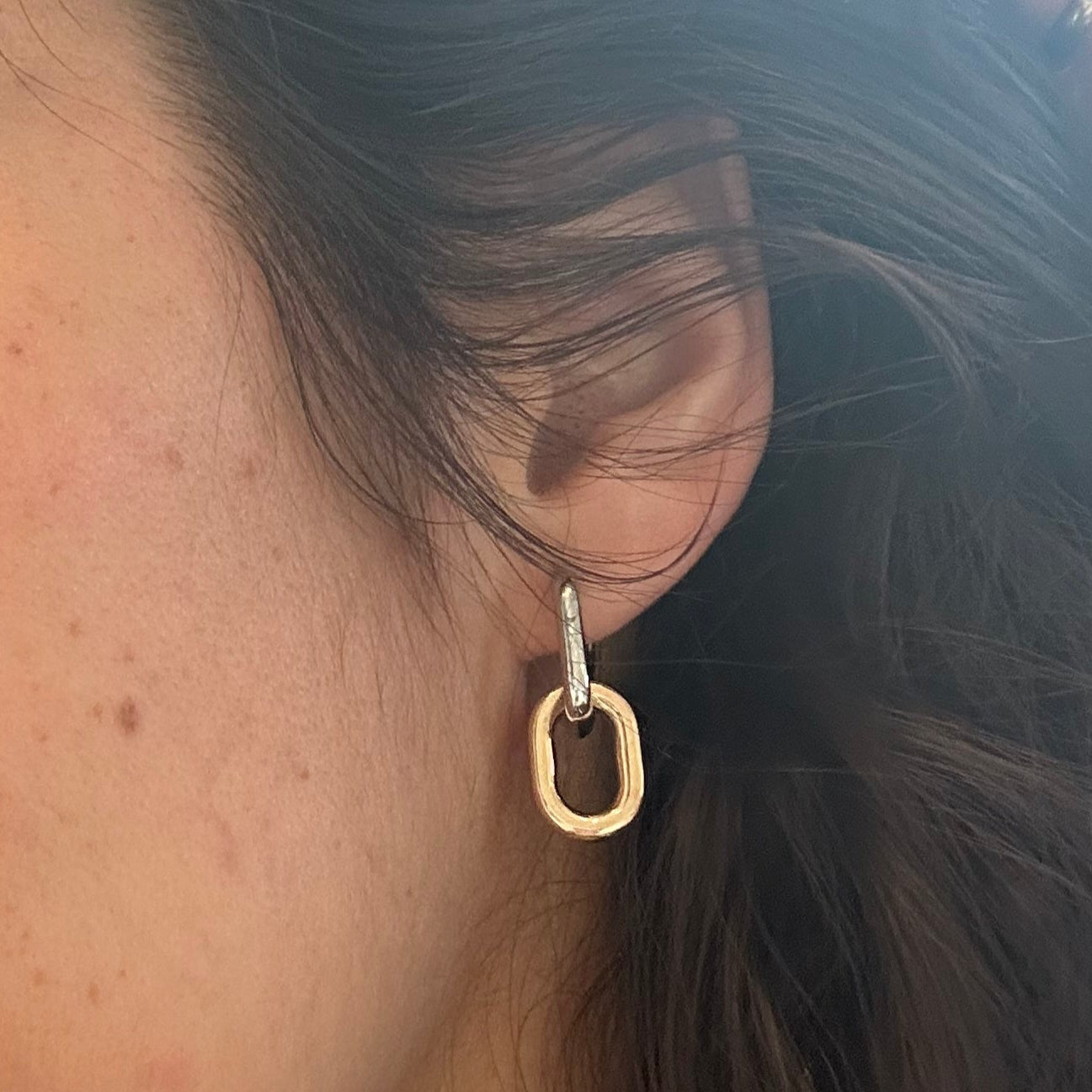 Close-up of a person with sunglasses on their head outdoors